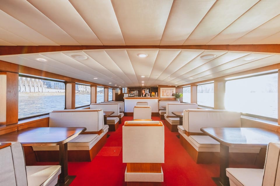 Budapest: Premium Sightseeing Cruise with Tokaj Frizzante - Getting comfortable on the boat: terrace views and indoor warmth